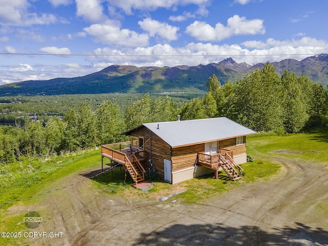 8153 Stewart Mountain Dr, Eagle River, AK 99577 - view of mountain backdrop featuring a heavily wooded area