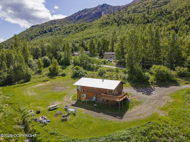 8153 Stewart Mountain Dr, Eagle River, AK 99577 - view of subject property with a mountain backdrop and a forest