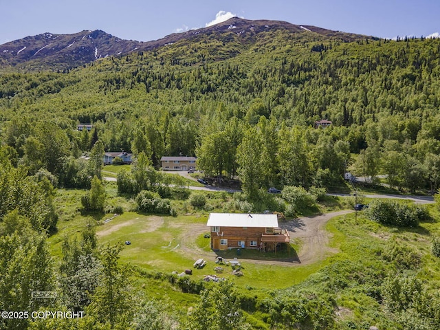 8153 Stewart Mountain Dr, Eagle River, AK 99577 - aerial overview of property's location featuring a forest and mountains