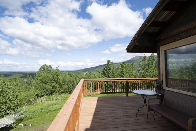 8153 Stewart Mountain Dr, Eagle River, AK 99577 - wooden terrace with a mountain view and a view of trees