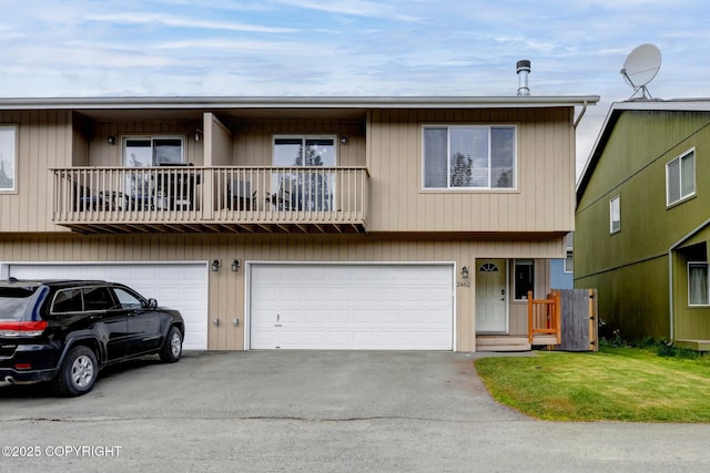2460 Lochenshire Pl Unit 21, Anchorage, AK 99504 - multi unit property with a balcony, a garage, and asphalt driveway