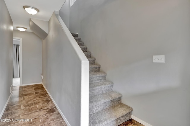 2460 Lochenshire Pl Unit 21, Anchorage, AK 99504 - stairs with baseboards