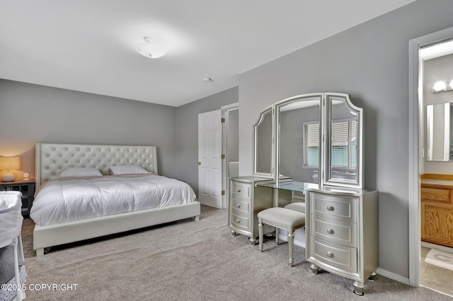 2460 Lochenshire Pl Unit 21, Anchorage, AK 99504 - bedroom featuring carpet floors, ensuite bathroom, and baseboards