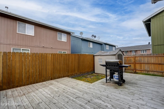 2460 Lochenshire Pl Unit 21, Anchorage, AK 99504 - deck featuring grilling area and a fenced backyard
