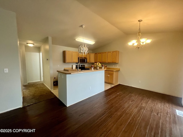 kitchen featuring light brown cabinetry, a chandelier, stainless steel appliances, and dark wood finished floors