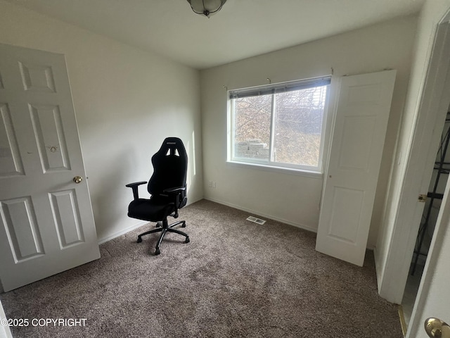 carpeted home office with baseboards and visible vents