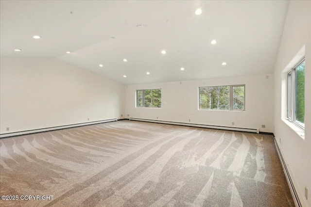 22309 Knik Vista St, Chugiak, AK 99567 - spare room with a baseboard heating unit, plenty of natural light, light colored carpet, lofted ceiling, and recessed lighting
