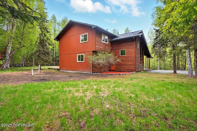 22309 Knik Vista St, Chugiak, AK 99567 - view of side of home featuring a yard