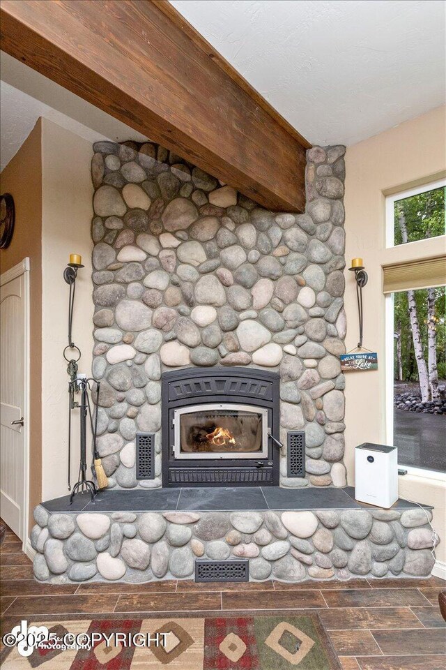 13598 N Willow Dr, Willow, AK 99688 - room details featuring visible vents, a stone fireplace, wood finished floors, and baseboards
