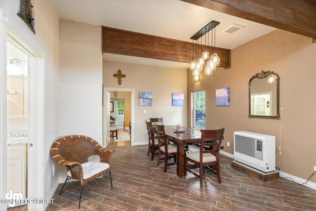 13598 N Willow Dr, Willow, AK 99688 - dining room featuring dark wood-style flooring, baseboards, heating unit, visible vents, and beam ceiling
