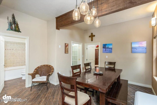 13598 N Willow Dr, Willow, AK 99688 - dining space featuring a notable chandelier, baseboards, beam ceiling, and dark wood-style floors