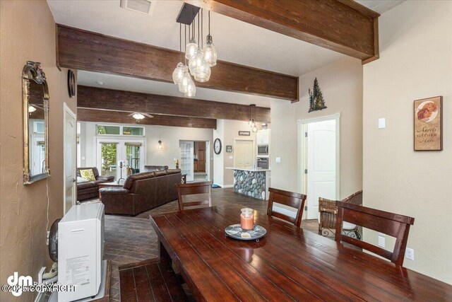 13598 N Willow Dr, Willow, AK 99688 - dining space featuring visible vents, ceiling fan with notable chandelier, beamed ceiling, and dark wood-style floors