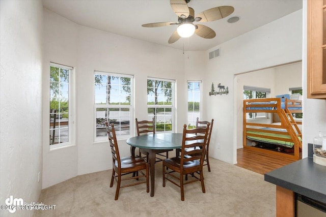 13598 N Willow Dr, Willow, AK 99688 - dining room featuring a high ceiling, visible vents, ceiling fan, and plenty of natural light