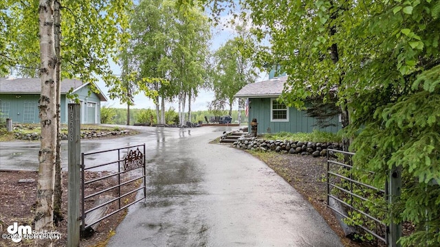 13598 N Willow Dr, Willow, AK 99688 - view of street featuring a gated entry, a gate, and driveway