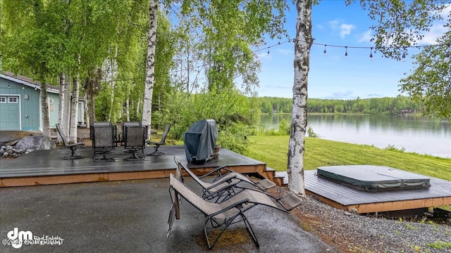 13598 N Willow Dr, Willow, AK 99688 - view of patio featuring a deck with water view, a covered hot tub, a grill, and outdoor dining space