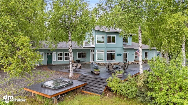 13598 N Willow Dr, Willow, AK 99688 - rear view of house featuring a deck and outdoor dining area