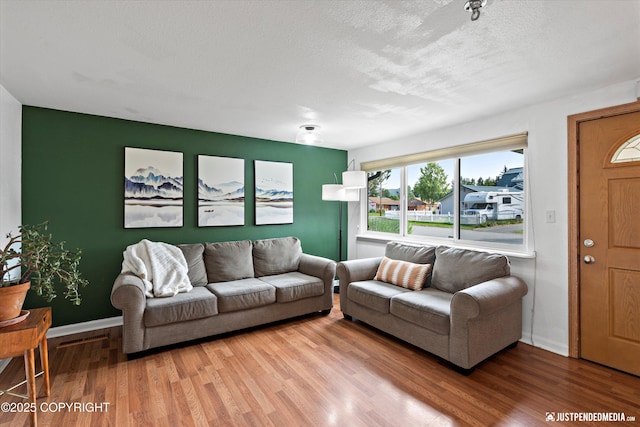 1602 Richardson Dr, Anchorage, AK 99504 - living area featuring light wood-style floors and a textured ceiling