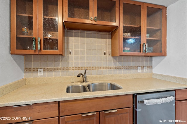 1602 Richardson Dr, Anchorage, AK 99504 - kitchen featuring stainless steel dishwasher, backsplash, glass insert cabinets, and brown cabinetry