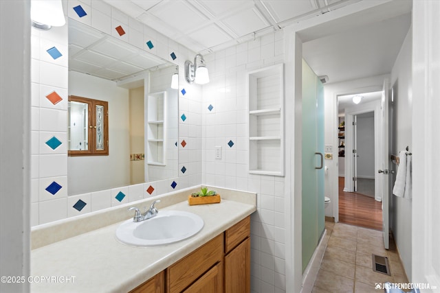 1602 Richardson Dr, Anchorage, AK 99504 - bathroom featuring vanity, tile patterned floors, and tile walls