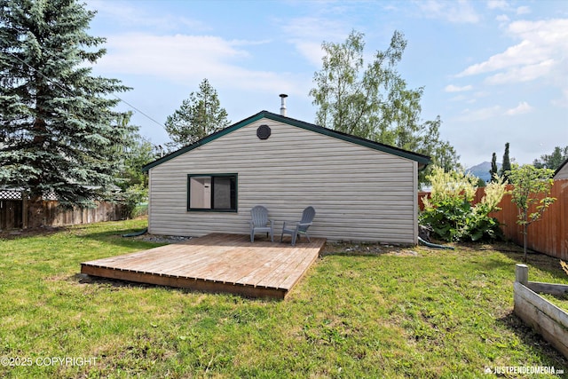 1602 Richardson Dr, Anchorage, AK 99504 - rear view of house with a fenced backyard and a deck