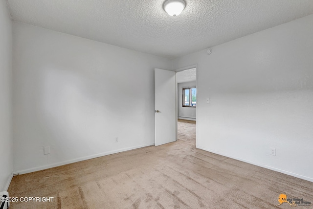 525 E 14th Ave, Anchorage, AK 99501 - empty room with a textured ceiling and carpet floors