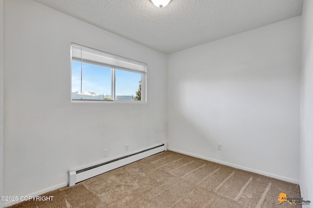 525 E 14th Ave, Anchorage, AK 99501 - unfurnished room with baseboard heating, carpet floors, and a textured ceiling