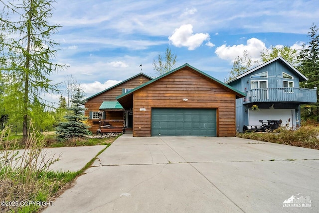 6537 Air Guard Rd, Anchorage, AK 99502 - chalet / cabin with driveway and a garage