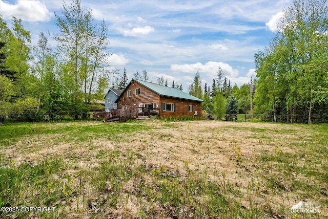 6537 Air Guard Rd, Anchorage, AK 99502 - view of yard with a deck