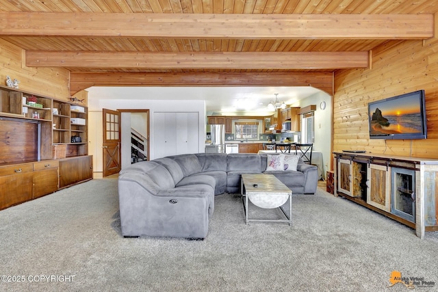6537 Air Guard Rd, Anchorage, AK 99502 - carpeted living room with wood ceiling with exposed beams and wood walls