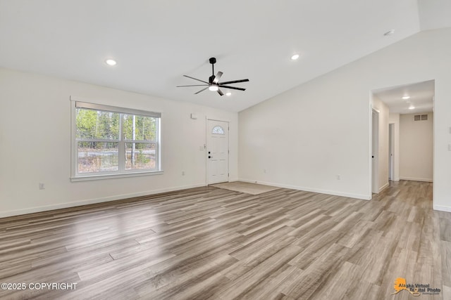 unfurnished living room featuring lofted ceiling, a ceiling fan, wood finished floors, baseboards, and recessed lighting