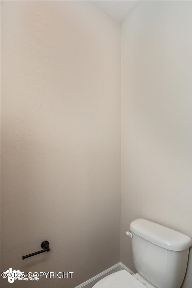 bathroom featuring toilet