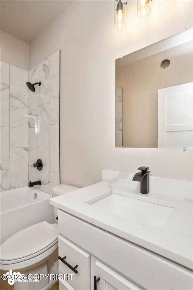 full bathroom featuring shower / tub combination, vanity, and toilet
