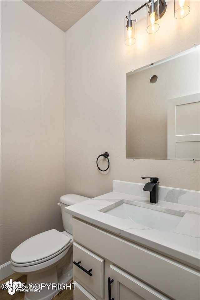 half bath with toilet and vanity