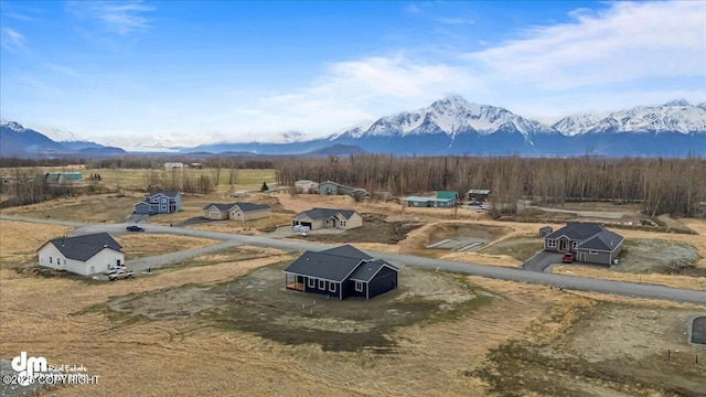 drone / aerial view featuring a mountain view and a rural view