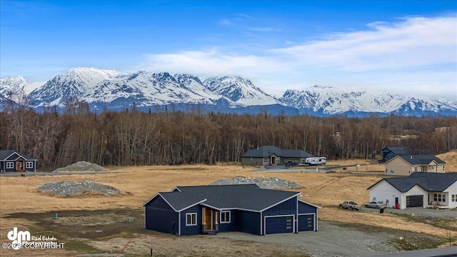 property view of mountains featuring a forest view