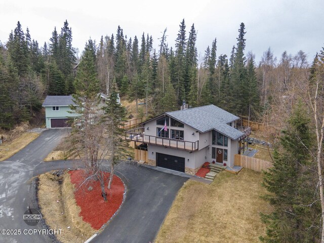 drone / aerial view featuring a view of trees