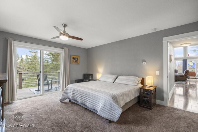 carpeted bedroom featuring ceiling fan, access to exterior, baseboards, and multiple windows