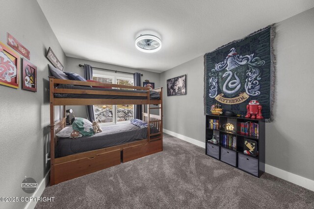 carpeted bedroom with baseboards