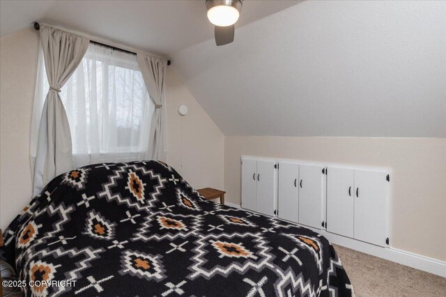 910 Refinery Loop, North Pole, AK 99705 - bedroom featuring baseboards, carpet floors, a ceiling fan, and lofted ceiling