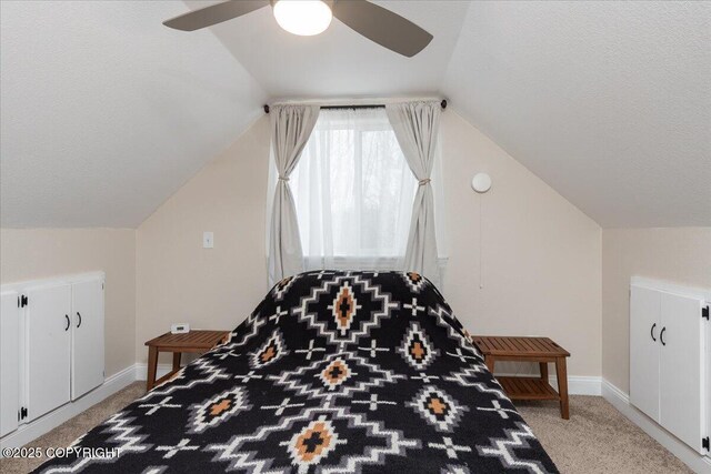 910 Refinery Loop, North Pole, AK 99705 - bedroom with baseboards, a ceiling fan, a textured ceiling, vaulted ceiling, and light carpet