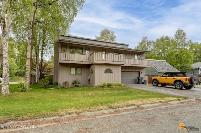 3210 Seawind Dr, Anchorage, AK 99516 - view of front of home with a balcony, asphalt driveway, a front yard, and an attached garage