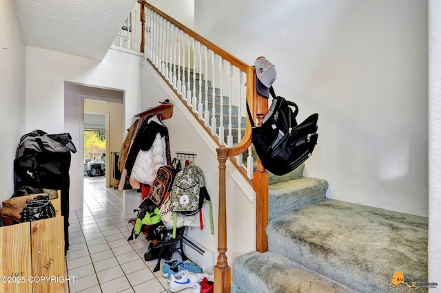 3210 Seawind Dr, Anchorage, AK 99516 - stairs with tile patterned floors and baseboard heating