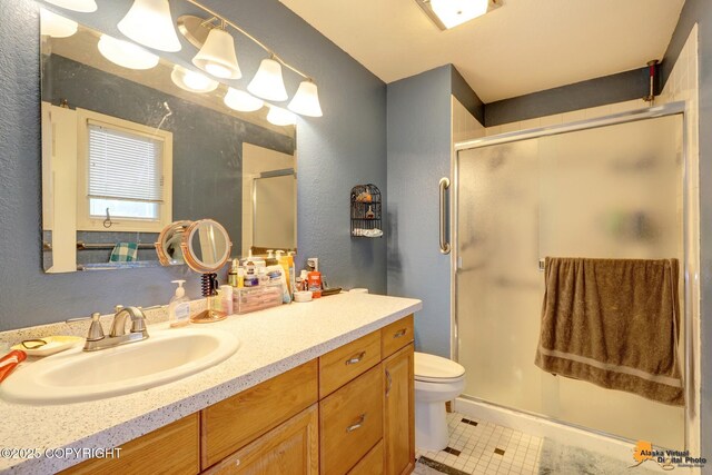 3210 Seawind Dr, Anchorage, AK 99516 - full bathroom featuring a textured wall, vanity, toilet, a shower stall, and tile patterned flooring