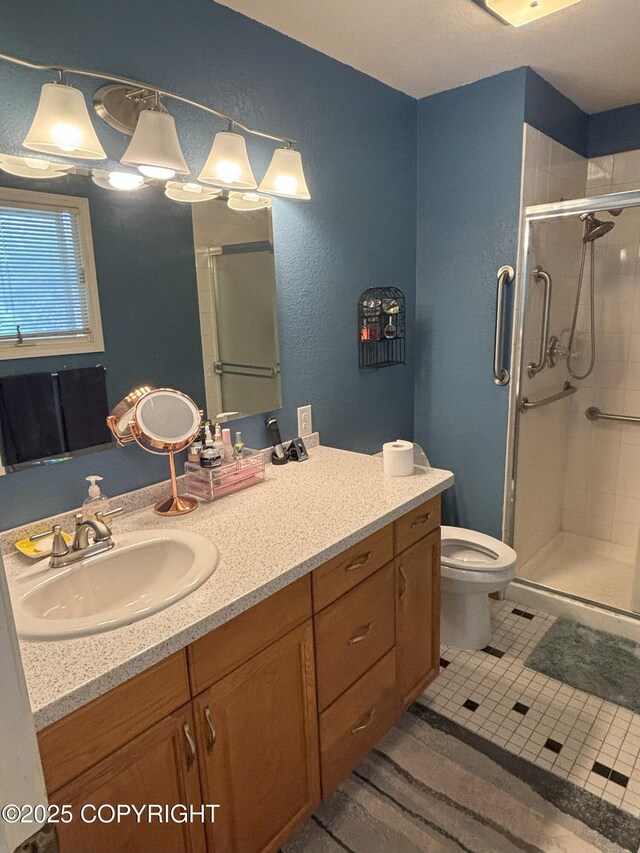 3210 Seawind Dr, Anchorage, AK 99516 - full bath with a stall shower, vanity, toilet, tile patterned flooring, and a textured wall