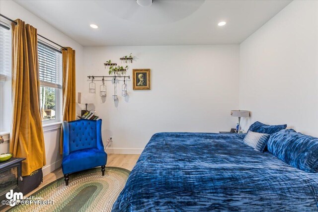 3460 S Shamrock St, Wasilla, AK 99623 - bedroom with wood finished floors, baseboards, and recessed lighting