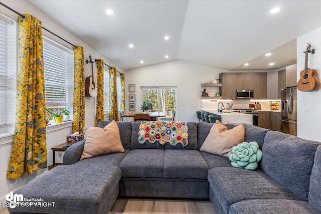 3460 S Shamrock St, Wasilla, AK 99623 - living area with wood finished floors, lofted ceiling, and recessed lighting