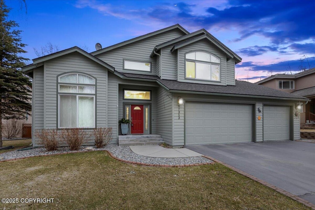 17353 Yellowstone Dr, Eagle River, AK 99577 - traditional-style house featuring driveway, a shingled roof, and a garage