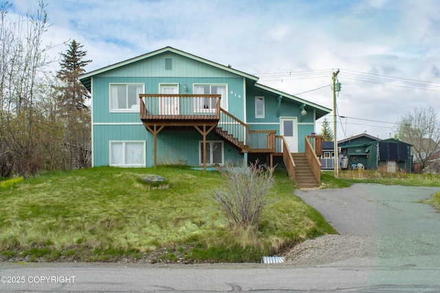 414 Bonanza Ave, Homer, AK 99603 - view of front of house with stairs, a deck, and a front yard