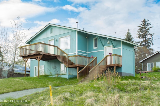 414 Bonanza Ave, Homer, AK 99603 - rear view of house with a wooden deck and stairway