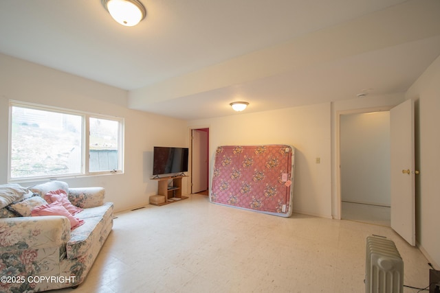 414 Bonanza Ave, Homer, AK 99603 - living area featuring light floors and radiator heating unit